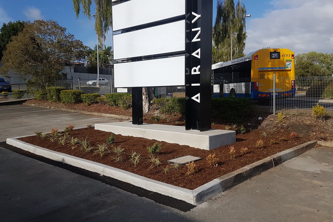Albany Creek Village — carpark with shade structures and feature trees